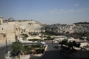 Mount of Olives in the background and the south end of the Temple Mount on the left side.  The city of David goes down the south side of the Temple Mount below where the Temple stood.