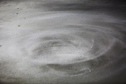 Another interesting phenomenon was the almost constant swirl of wind in the cove. The onshore wind hits the steep sides and spins a whirlwind which creates this pretty spinning patter in the hard packed sand.